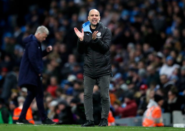 Manchester City manager Pep Guardiola encourages his team 