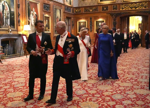 The King with France’s President Emmanuel Macron (left) at the State Banquet for President of France Emmanuel Macron and his wife Brigitte Macron at Windsor Castle, Berkshire, on day one of the French president’s state visit to the UK