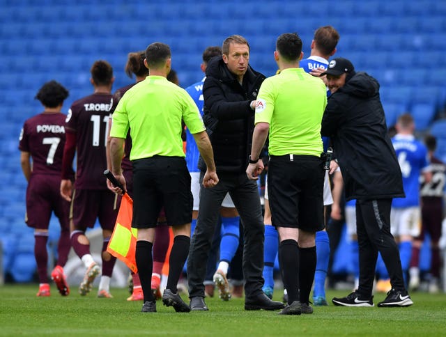 Graham Potter shakes hands with the officials 