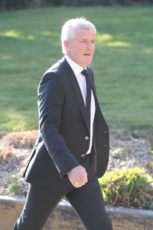 Mark Hughes arrives at the service