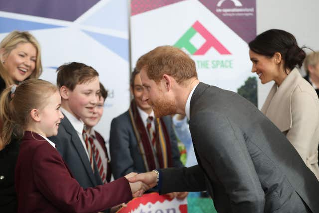 Pleased to meet you - Harry greets young fans at the Eikon Exhibition Centre in Lisburn (Niall Carson/PA)