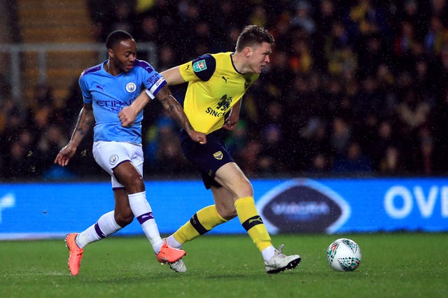 Oxford's Robert Dickie takes on Manchester City's Raheem Sterling in the Carabao Cup quarter-final