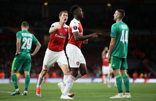 Danny Welbeck, centre right, added a second for Arsenal