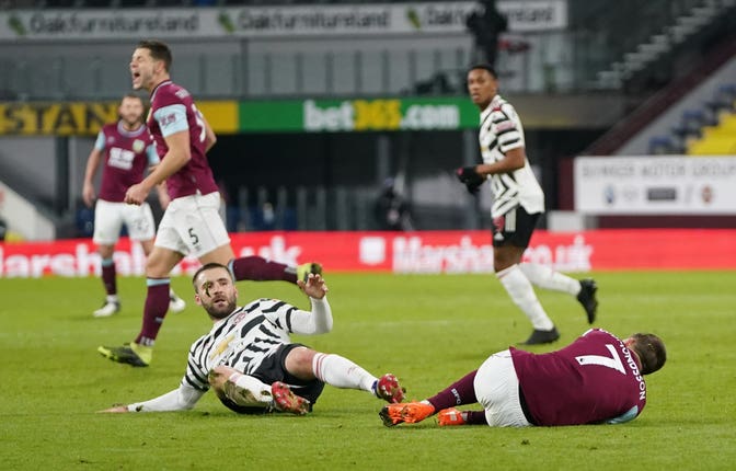 Luke Shaw, left, fouls Johann Berg Gudmundsson