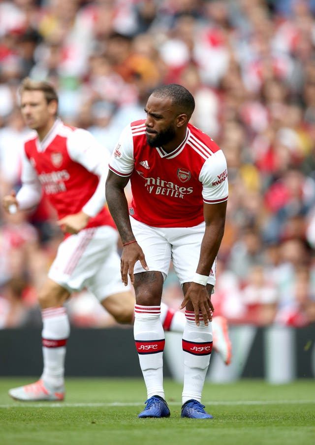 Alexandre Lacazette reacts after suffering an injury against Lyon