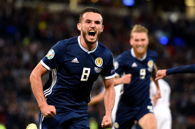 John McGinn celebrates scoring for Scotland