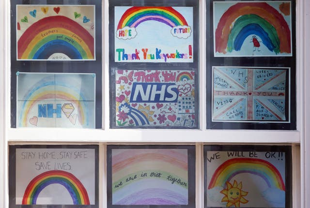 Pictures of rainbows with supportive messages for the NHS displayed in a window in Downing Street