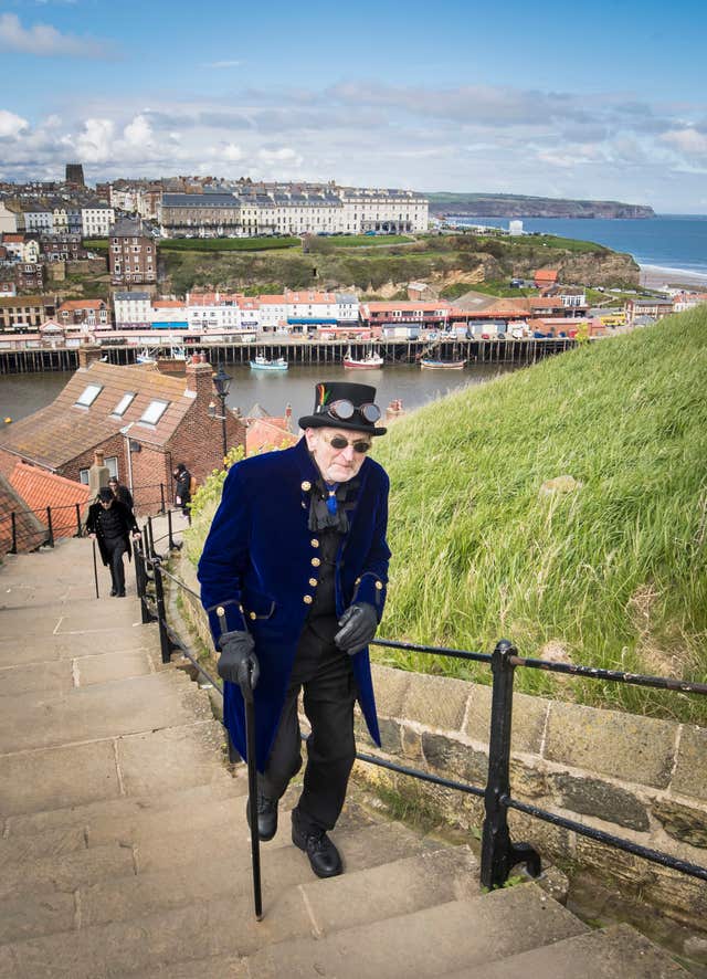 A man makes his way up Whitby's steps (Danny Lawson/PA)