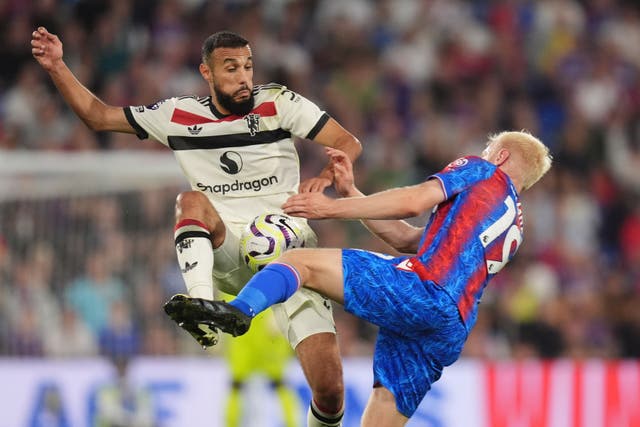 Manchester United’s Noussair Mazraoui (left) battled for the ball with Crystal Palace’s Will Hughes