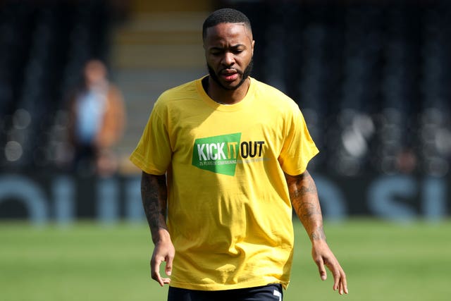 Manchester City's Raheem Sterling warms up in a Kick It Out T-Shirt