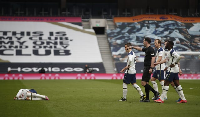 Son Heung-min, left, fell to the floor holding his face as United saw an opening goal disallowed