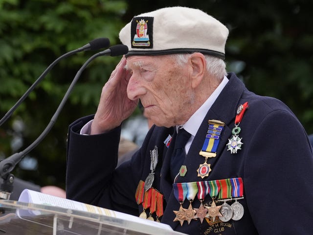 Alec Penstone, then aged 98, in his Navy uniform giving the salute