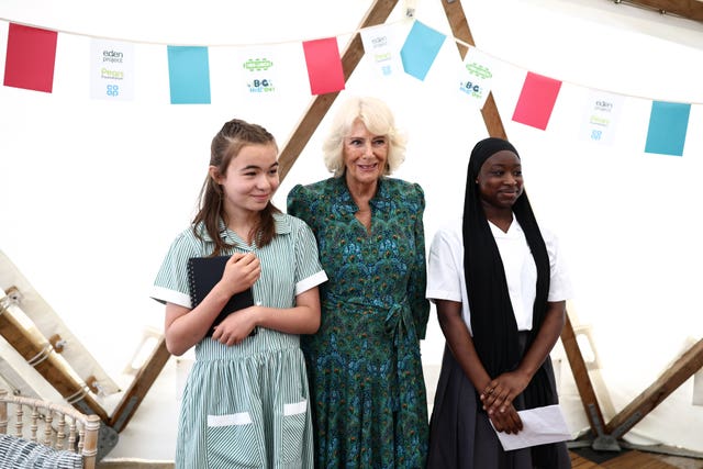 The Queen poses for a picture with London’s newly appointed Young Poet Laureates