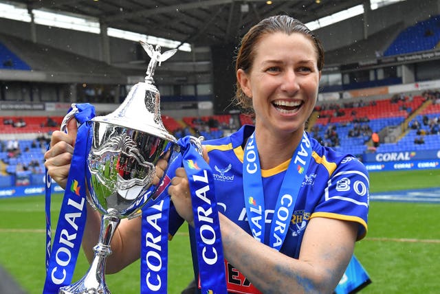 Leeds captain Courtney Hill celebrates with the Coral Women's Challenge Cup trophy