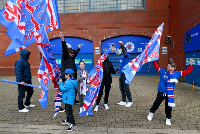 Rangers fans celebrate outside Ibrox
