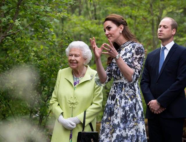 The Queen with the Duke and Duchess of Cambridge during their visit to the Chelsea Flower Show in 2019. Geoff Pugh/PA Wire