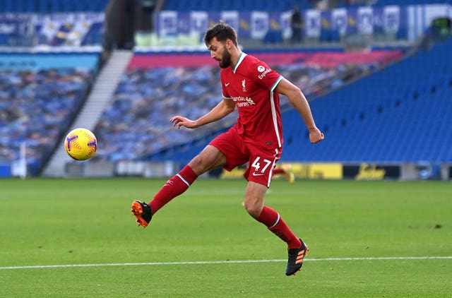 LIverpool defender Nat Phillips clears the ball