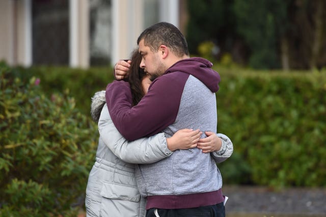 Reece Platt-May, the father of brothers Corey and Casper, hugs his sister Tia Fletcher close to the scene where the boys, aged six and two, were killed (Joe Giddens/PA)
