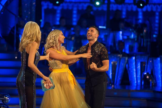 Tess Daly (left) with Faye Tozer and Giovanni Pernice