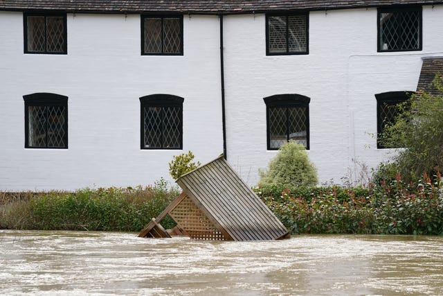 A garden arbour floats in the River Severn