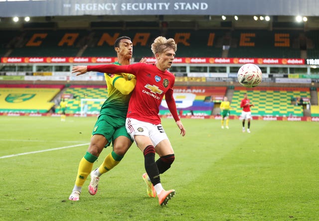 Brandon Williams (right) in action for Manchester United at Carrow Road