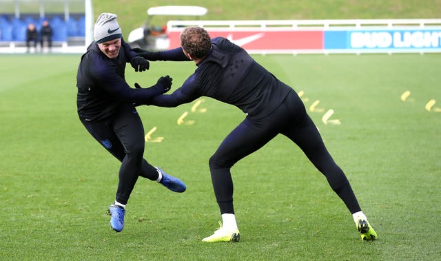 Wayne Rooney, left, tries to escape Kyle Walker's attention in training