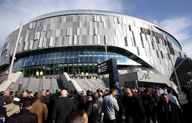 Fans arrive at the Tottenham Hotspur Stadium