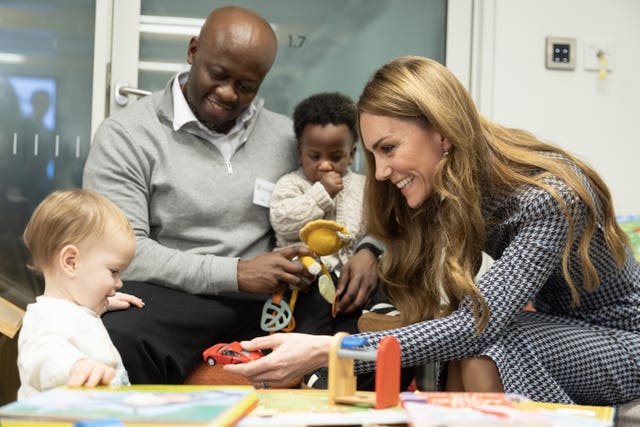 The Princess of Wales plays with 13-month-old Amelia Baddeley on a visit in north London last November