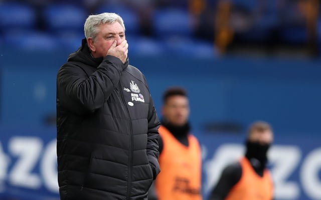 Newcastle manager Steve Bruce covers his mouth on the touchline