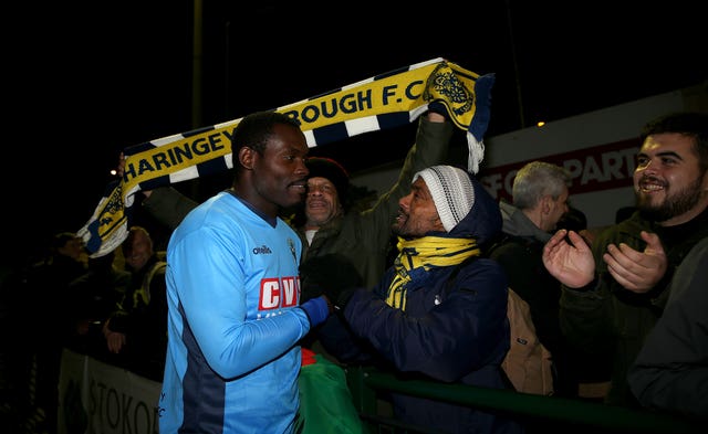 Haringey Borough goalkeeper Valery Pajetat greets the home fans after the game