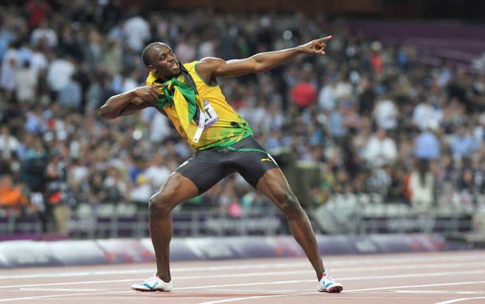 Usain Bolt does his trademark ‘Lightening Bolt’ after winning the 200m final