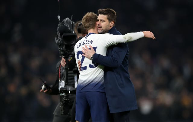 Tottenham manager Mauricio Pochettino embraces Christian Eriksen after the final whistle