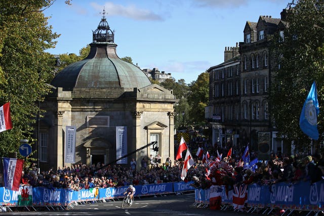 Lizzie Deignan rides by the pump room in Harrogate