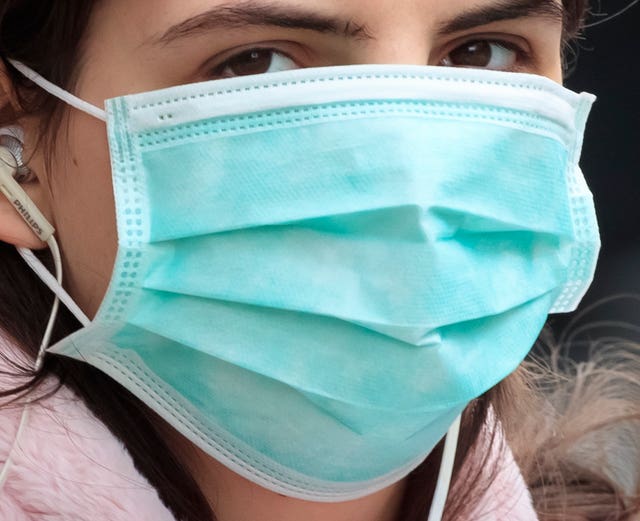 People could be advised to wear face masks on public transport (Danny Lawson/PA)
