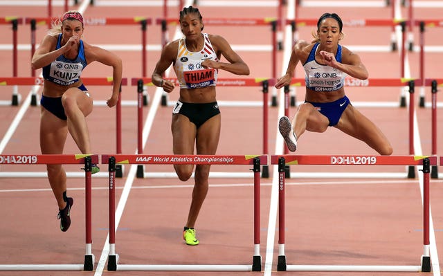 USA's Annie Kunz, Belgium's Nafi Thiam and Johnson-Thompson, right, compete in the women's heptathlon 100m hurdles 