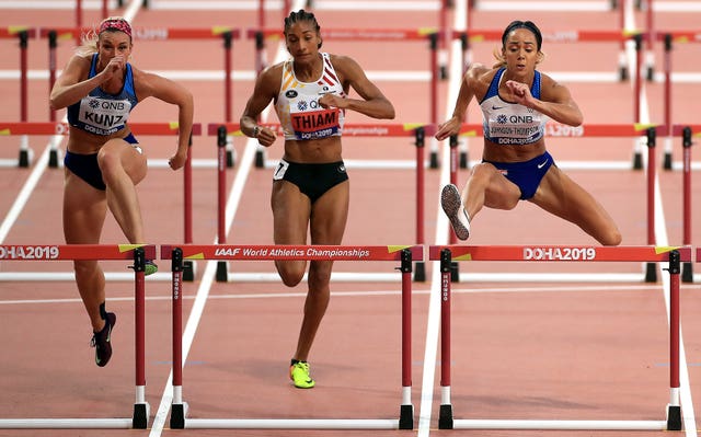 USA's Annie Kunz, Belgium's Nafi Thiam and Johnson-Thompson, right, compete in the women's heptathlon 100m hurdles