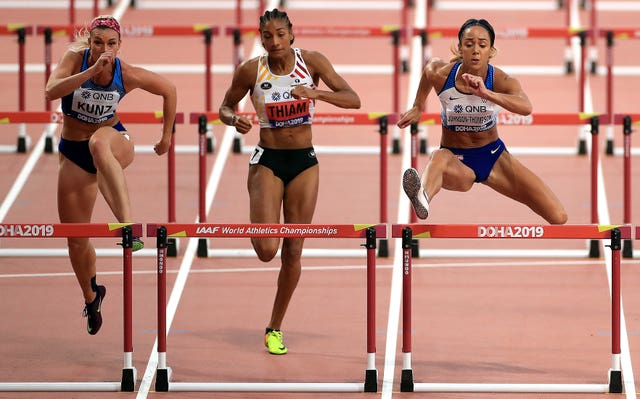 USA's Annie Kunz, Belgium's Nafi Thiam and Johnson-Thompson, right, compete in the women's heptathlon 100m hurdles 