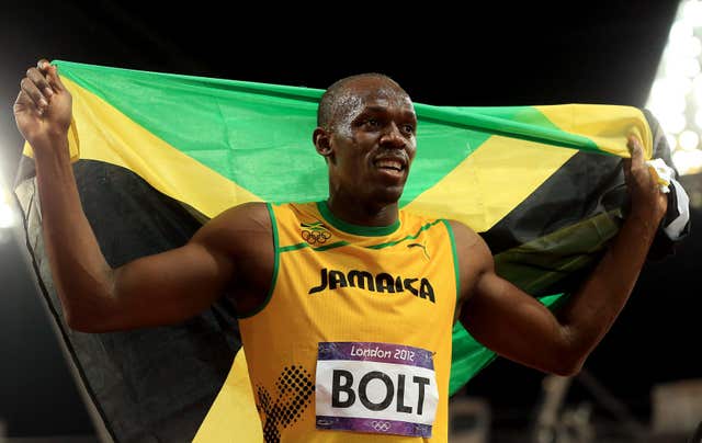 Usain Bolt celebrates winning 100m gold at the 2012 London Olympics