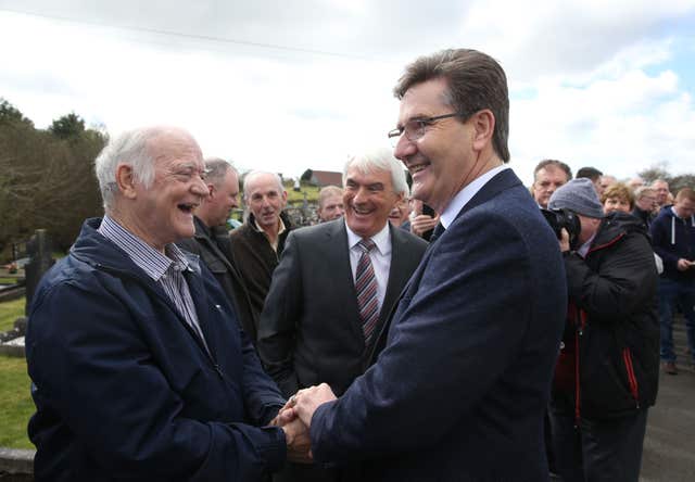 Daniel O’Donnell greeted by a mourner at the funeral of country music star Big Tom McBride (Brian Lawless/PA)