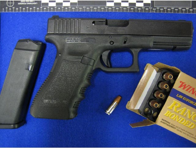 A Glock pistol and ammunition shown in evidence during the trial of Kyle Davies