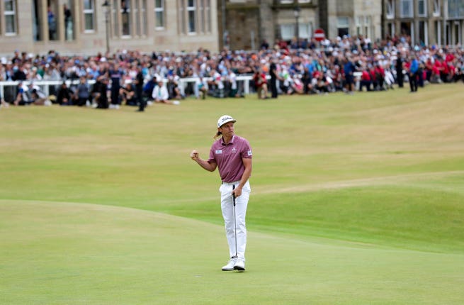 Smith celebrates his birdie on the 18th after a brilliant final round of 64 clinched him a one-shot victory in the 150th Open Championship