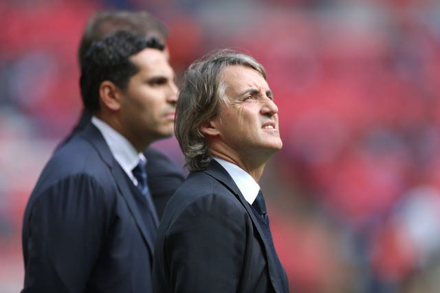 Documents published by Der Spiegel alleged former Manchester City manager Roberto Mancini, right, had a 'shadow contract' with a second club linked to City owner Sheikh Mansour