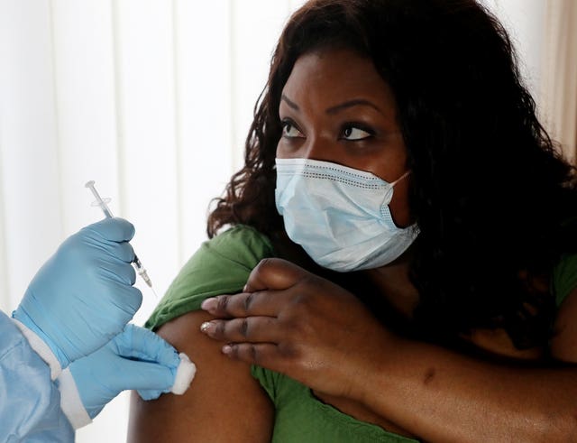 A woman being given an injection
