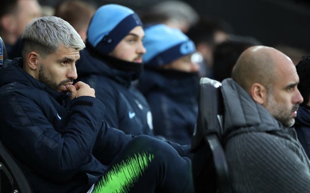 Pep Guardiola, right, and substitutes including Sergio Aguero, left, watch on anxiously