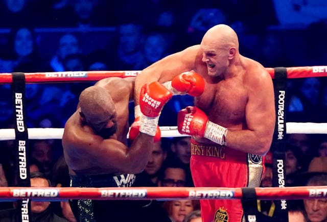 Tyson Fury (right) beat Derek Chisora in December