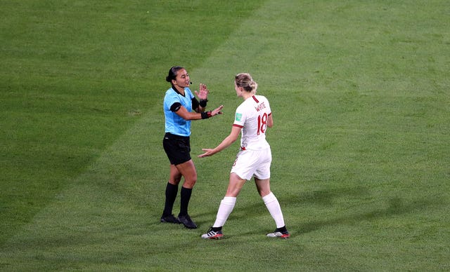 White argues the decision with referee Edina Alves