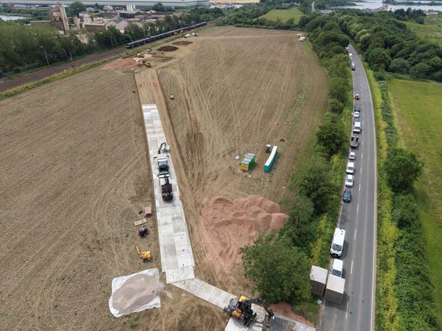 Work to build a temporary access road and concrete foundation to support the operation of a crane in the recovery of the East Midlands Railway trains involved in a crash near Bedford
