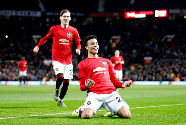 Mason Greenwood and fellow academy graduate James Garner celebrate wrapping up victory against AZ Alkmaar