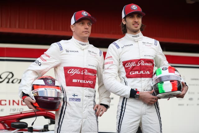 Kimi Raikkonen (left) and new team-mate Antonio Giovinazzi