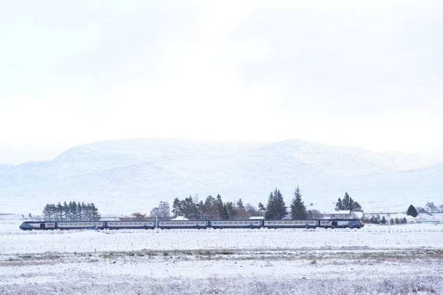A train travelling from Inverness through snowy conditions near Dalwhinnie